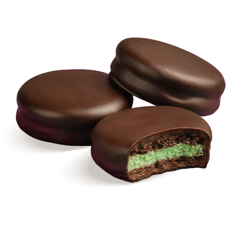 Three Puyallup Chocolates Dark Chocolate Covered Mint Stack cookies, one with the middle exposed showing layers of dark chocolate, chocolate wafer, and mint filling